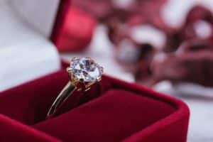Solitaire engagement ring in red box