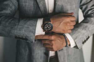 Man in Gray Suit Wearing Luxury Watch