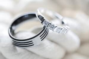 close up of men's and women's wedding bands