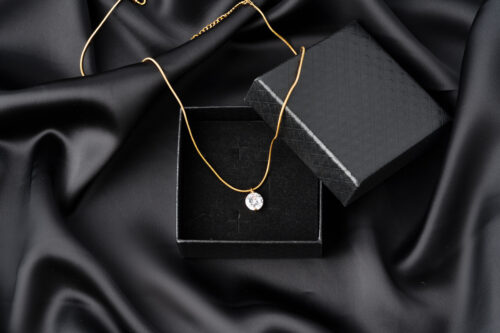 Diamond pendant on a silk background